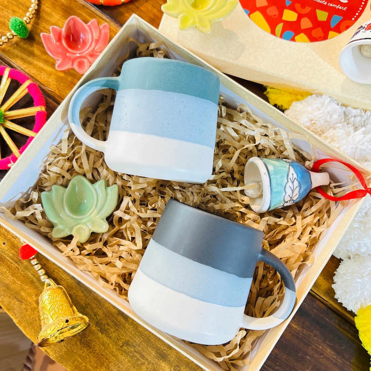 Festive Ceramic Mug Gift Hamper – 2 Mugs with Lotus Diya & Bell