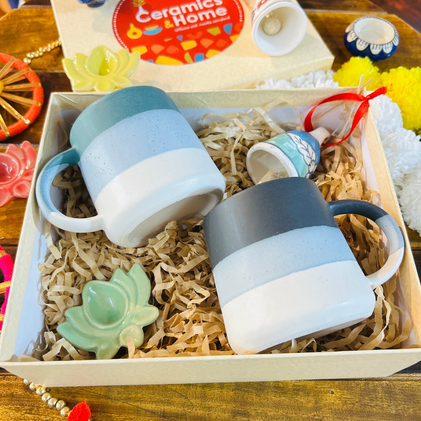 Festive Ceramic Mug Gift Hamper – 2 Mugs with Lotus Diya & Bell